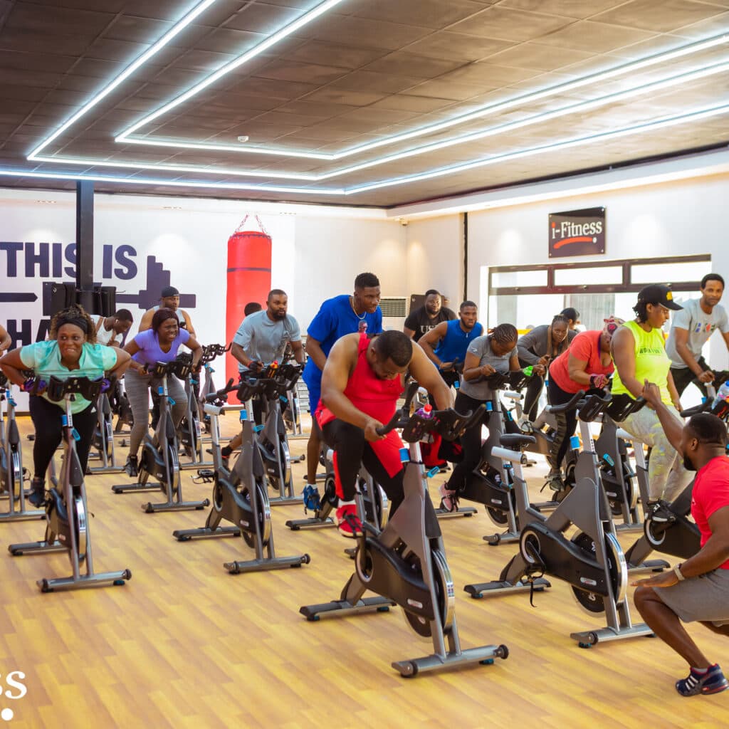Members in an i-Fitness cycling class